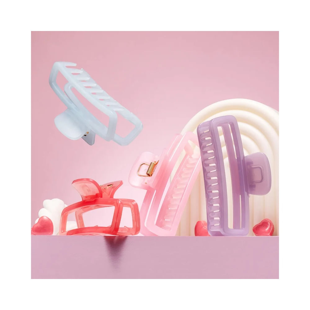 Várias piranhas de cabelo em cores pastel incluindo rosa candy, lilás e azul claro, design moderno e translúcido